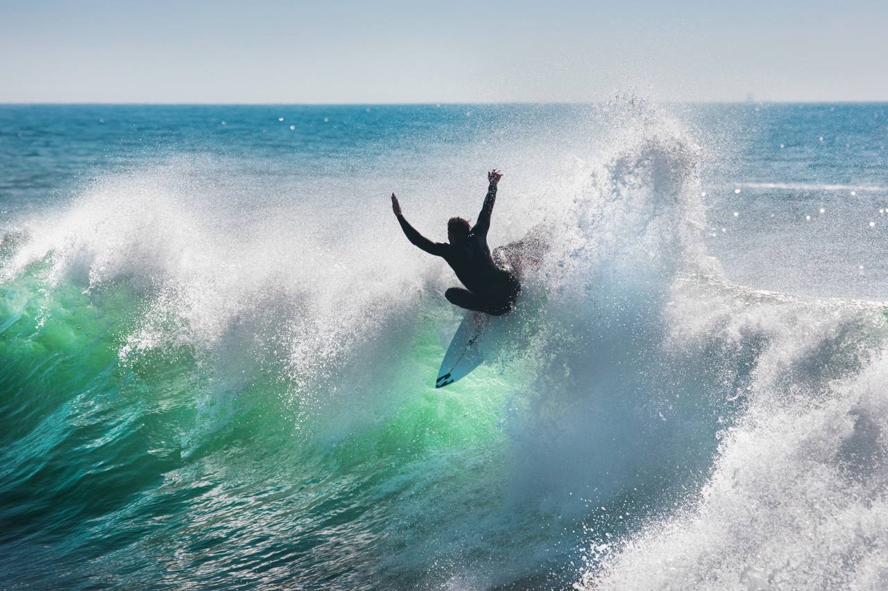 Surfer launching an aerial at Anchor Point in Taghazout