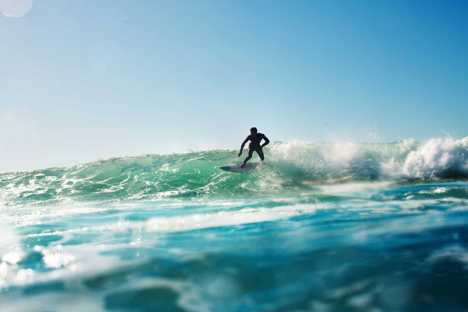 Surfer riding a wall at Tamri in Morocco