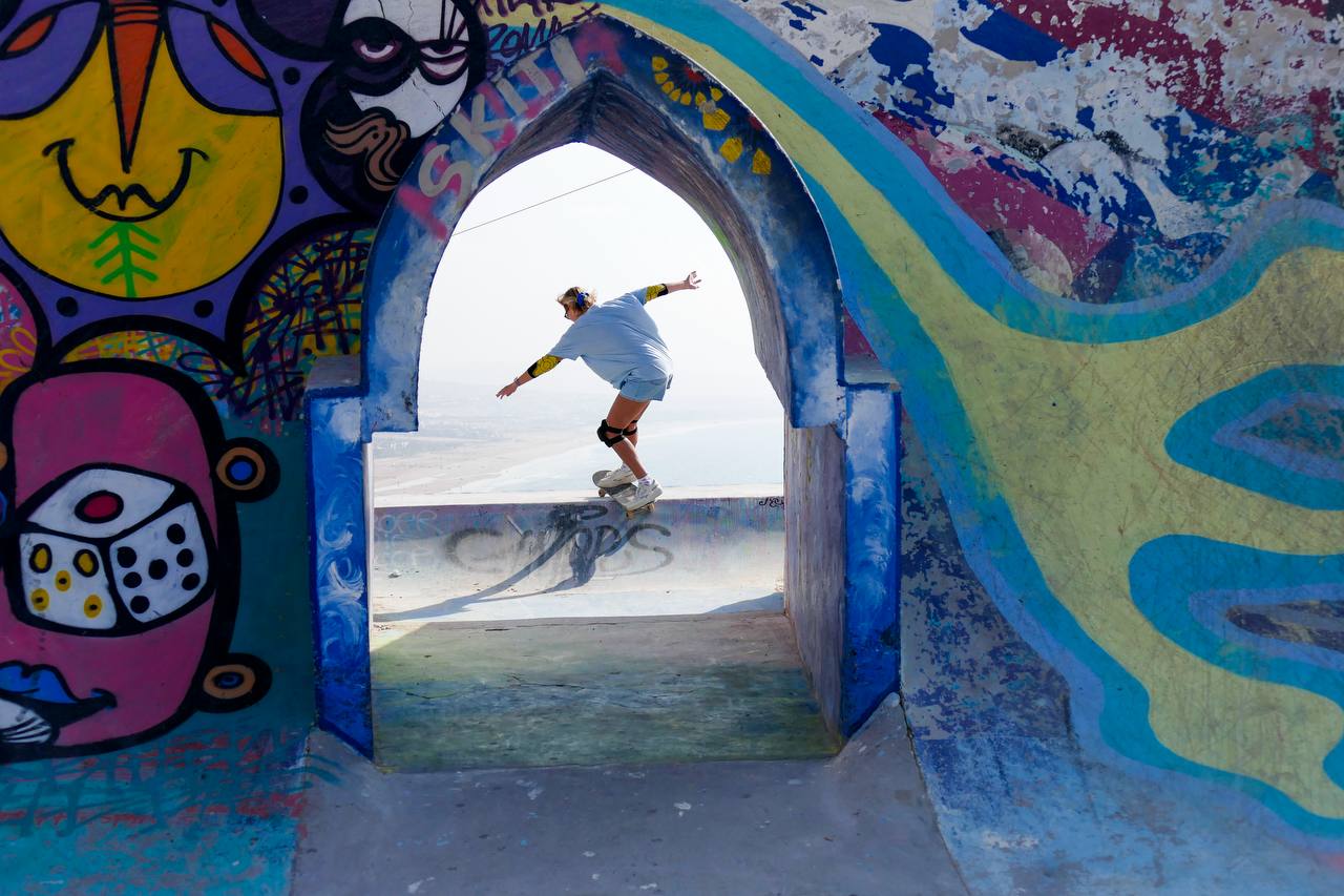 Taghazout beach moment with surfers and ocean backdrop